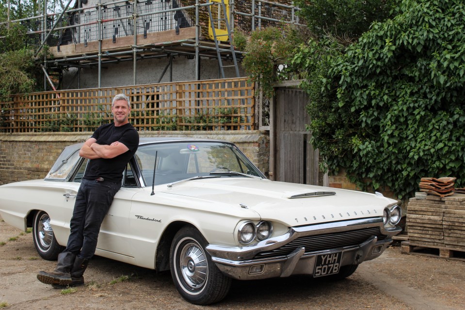 Ant Anstead sitting on the bonnett of a Thunderbird car outside of the farmhouse for his new show