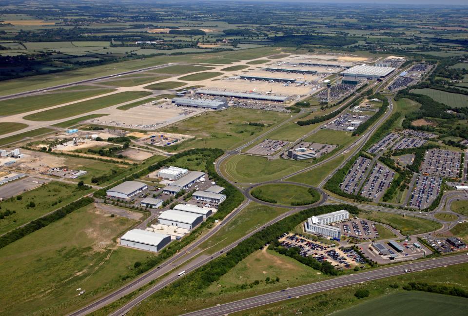 an aerial view of a large airport with lots of parking lots