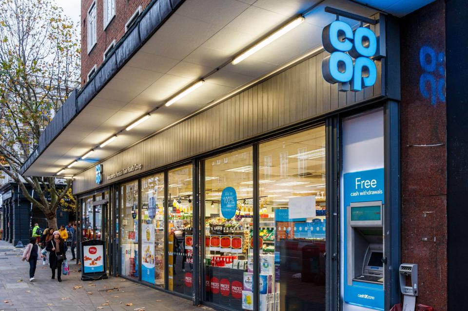 a co op store has a free cash machine in front of it