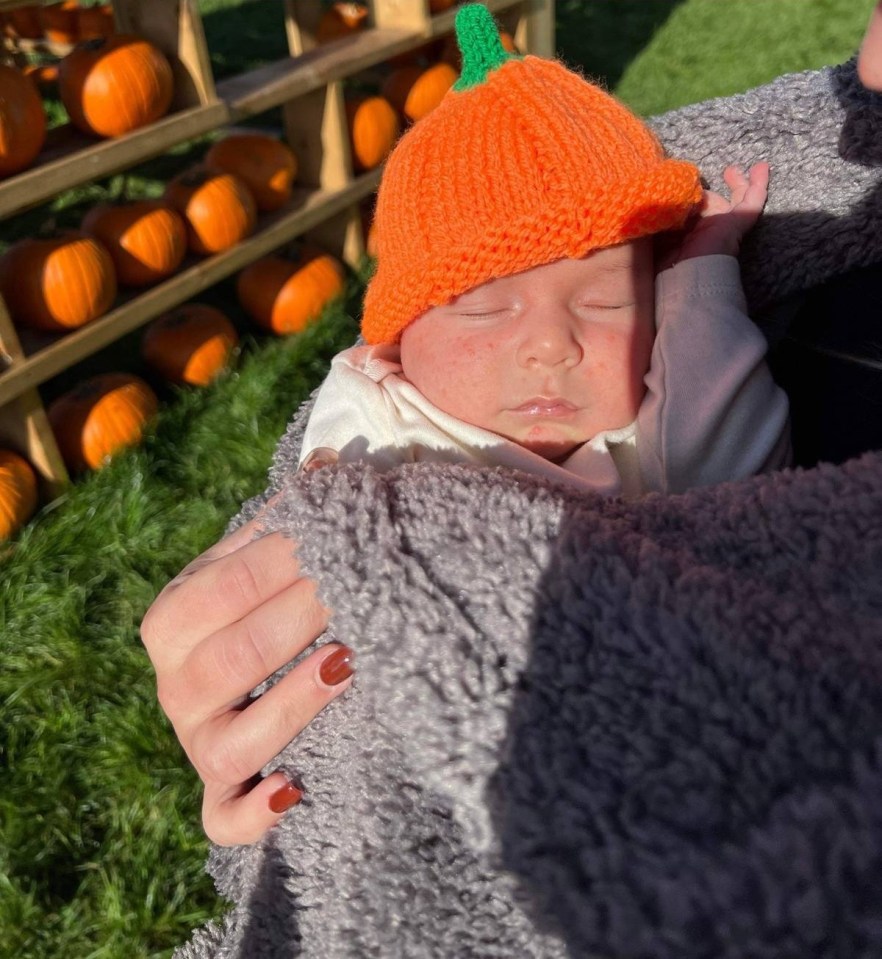 She'd dressed her baby boy in an adorable pumpkin knitted hat for the outfit