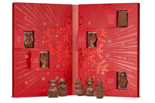 a red christmas advent calendar with a green background