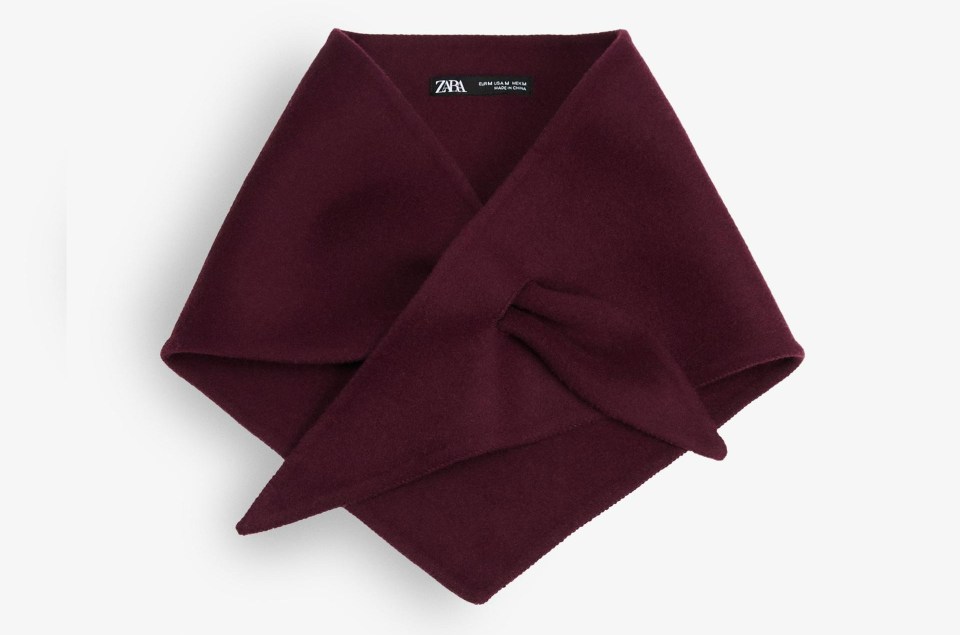 a purple scarf with the word zara on it