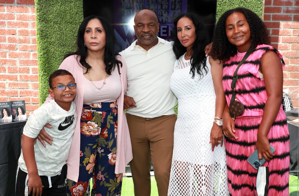 Tyson with son Morocco, far left, mother-in-law Rita Ali, wife Lakiha Spicer and daughter Milan, far right