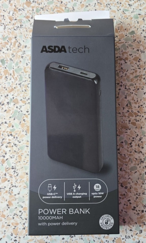 a black asda tech power bank sits on a table