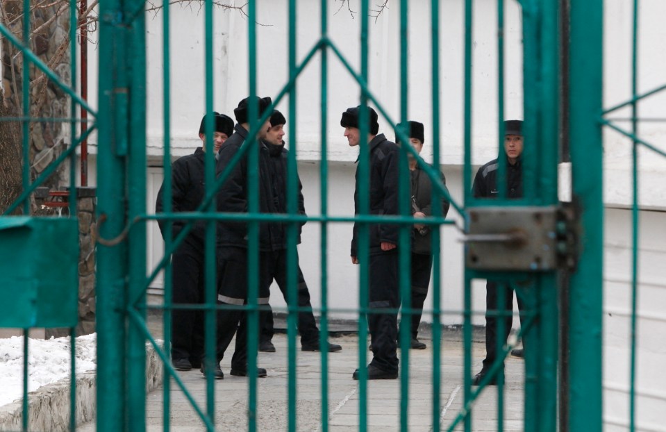 Russian convicts chat amongst themselves in the yard of the prison at Kochubeyevskoy, near the southern Russian city of Stavropol