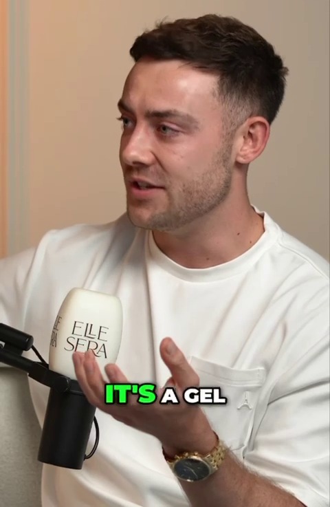 a man talking into a microphone with the words it 's a gel above him