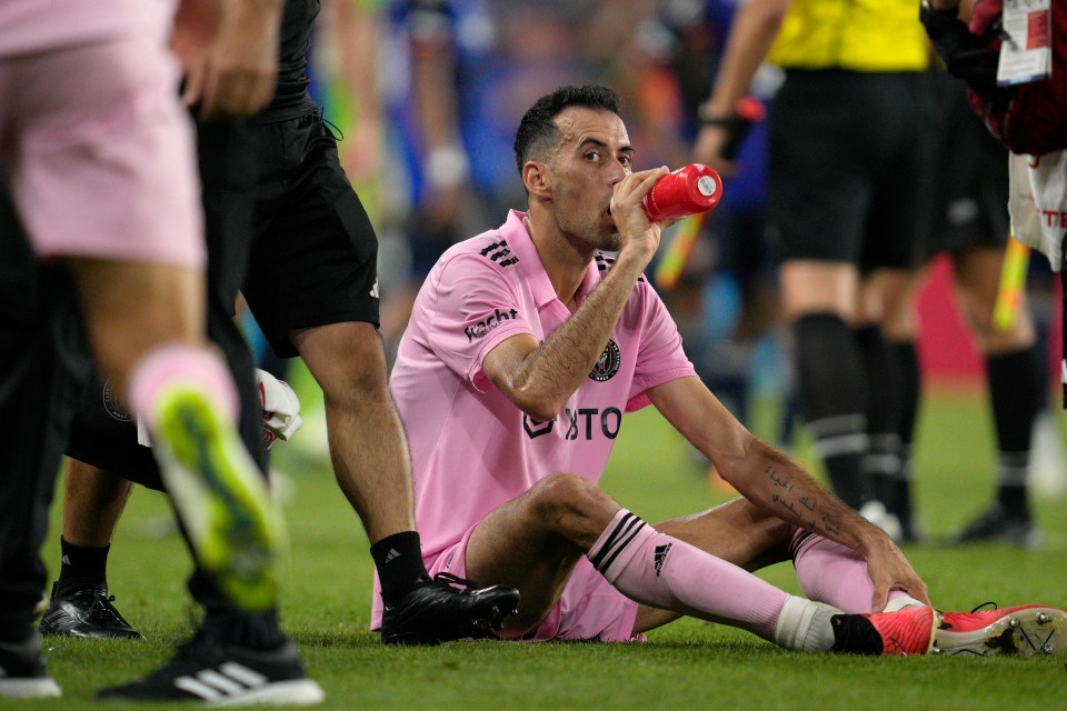 a soccer player wearing a pink shirt that says ' uto ' on it