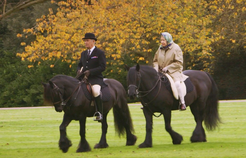 a man and a woman are riding horses in a field