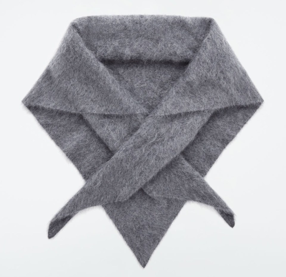 a grey scarf with a triangle shaped collar