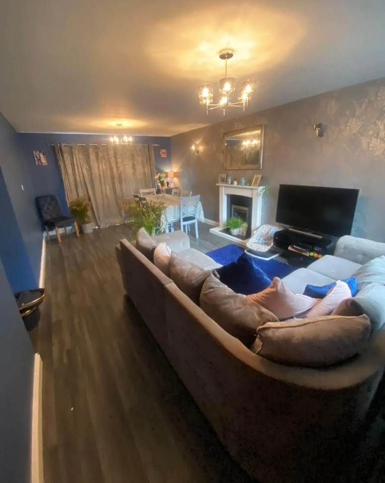 A photo revealed the living room was once ordinary with blue and grey decor