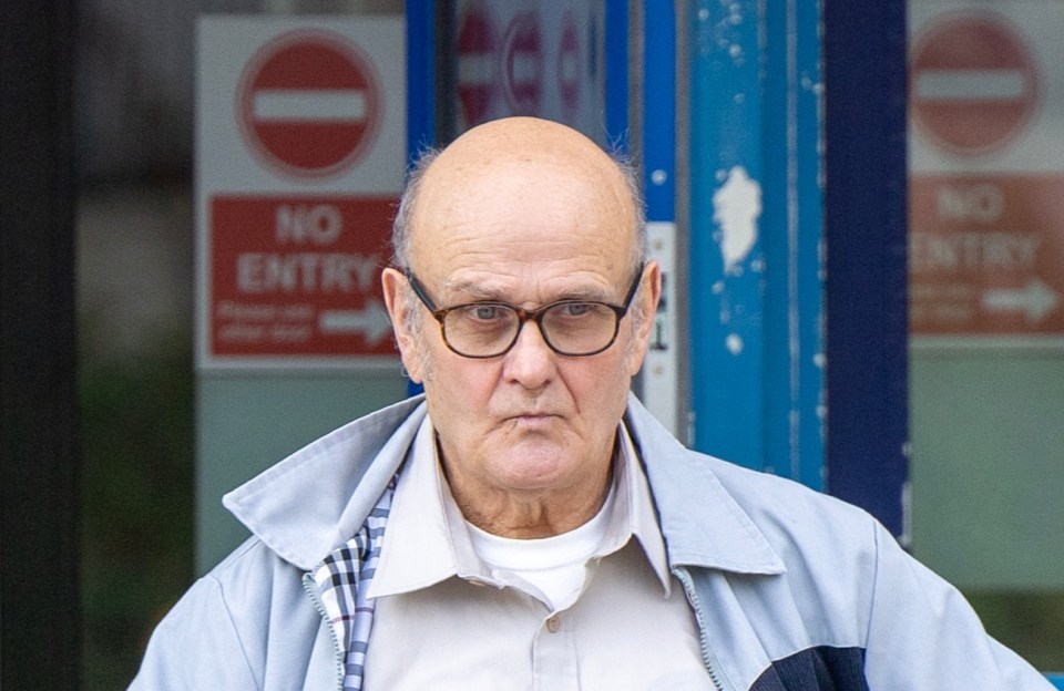 a man walking down stairs with a no entry sign on the door