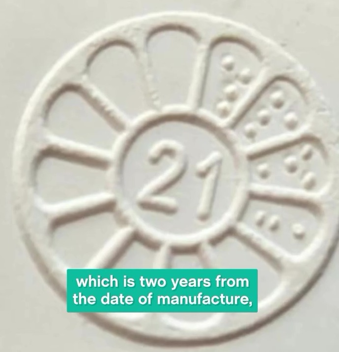 Hot water bottles have a symbol at the top which states the year it was manufactured, and a daisy wheel showing the month - with this one being April 2021