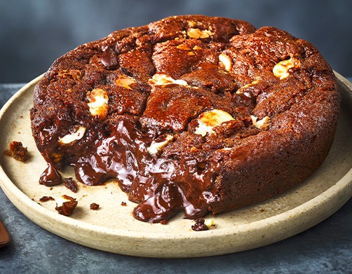 a brownie with a bite taken out of it on a plate