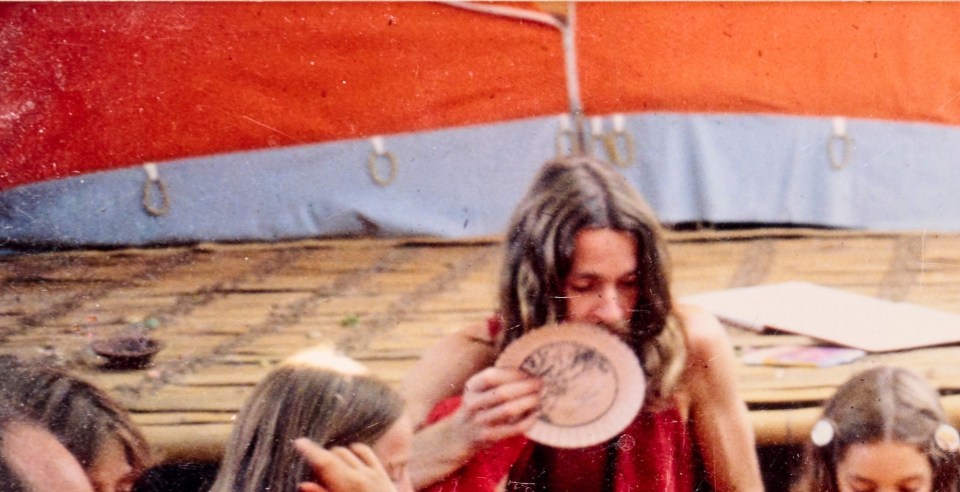 Sharna, pictured with the plate, was headmaster at two English Osho schools