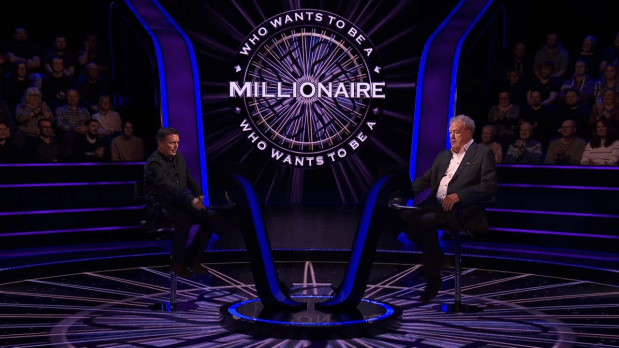 two men are sitting in front of a screen that says who wants to be a millionaire