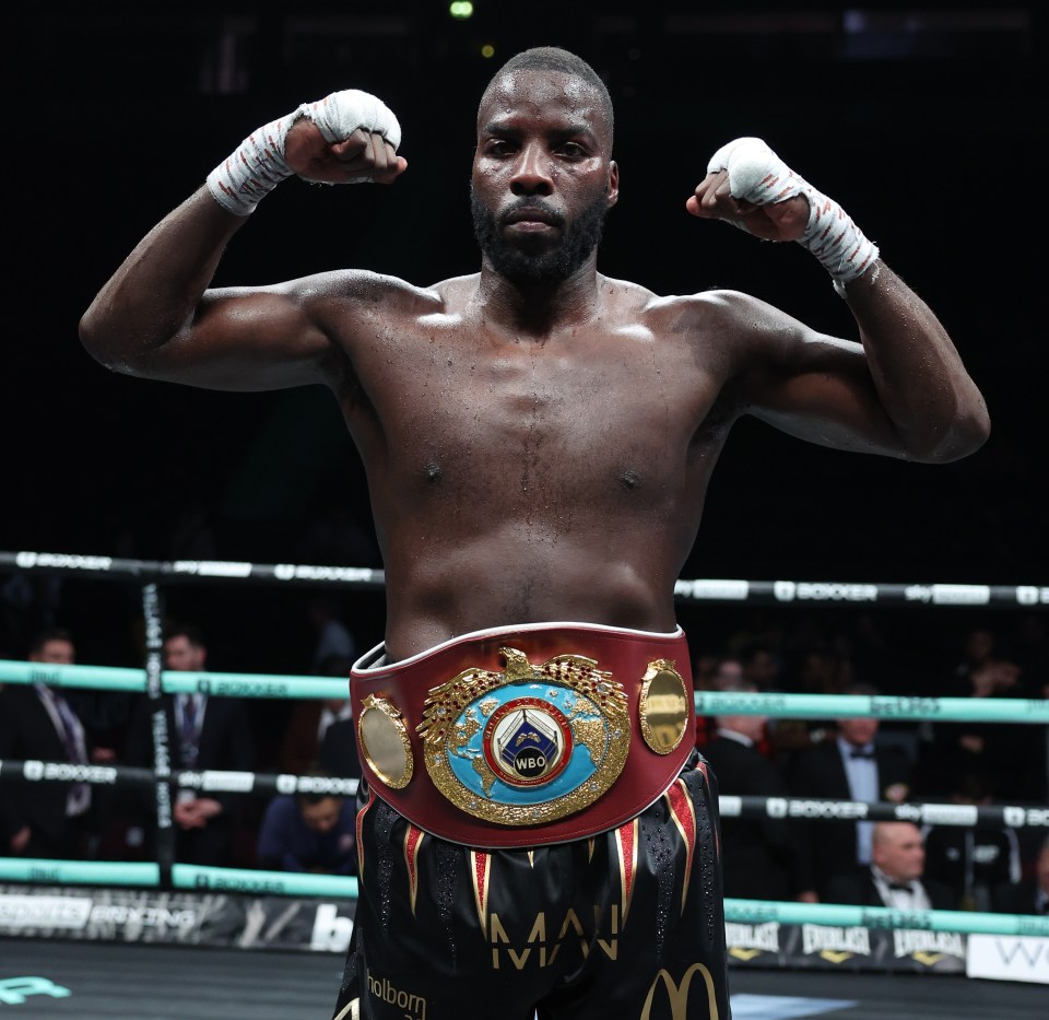 a man in a boxing ring wearing a mcdonald 's shorts