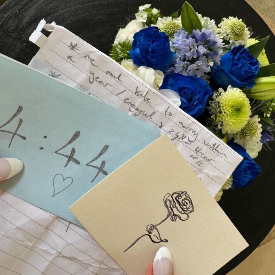 a bouquet of blue and white flowers with a note that says 4:44