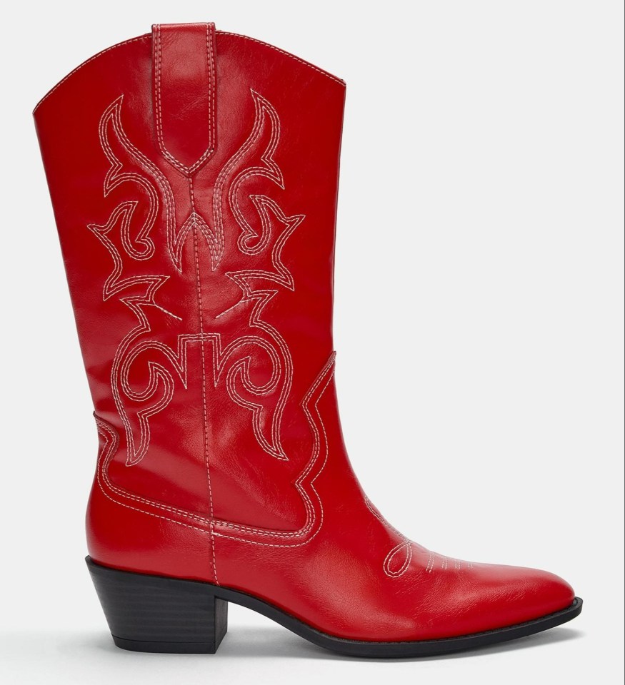 a pair of red cowboy boots on a white background