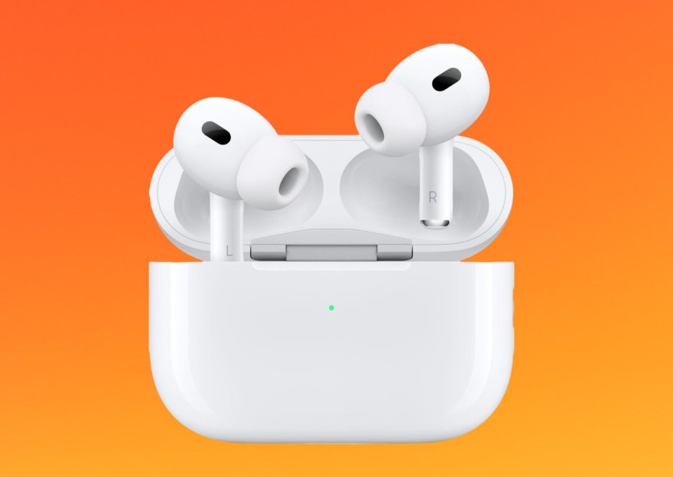 a pair of white earbuds with the charging case open