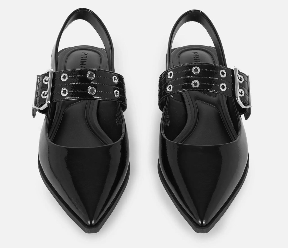 a pair of black shoes with the word prima on the side