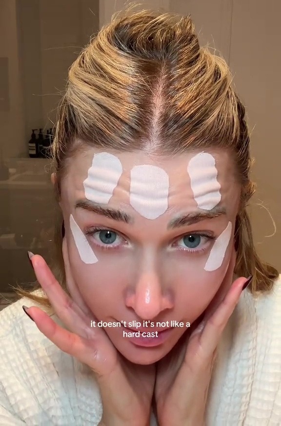 She showed how the tape doesn't form a hard cast, and can be applied over skincare