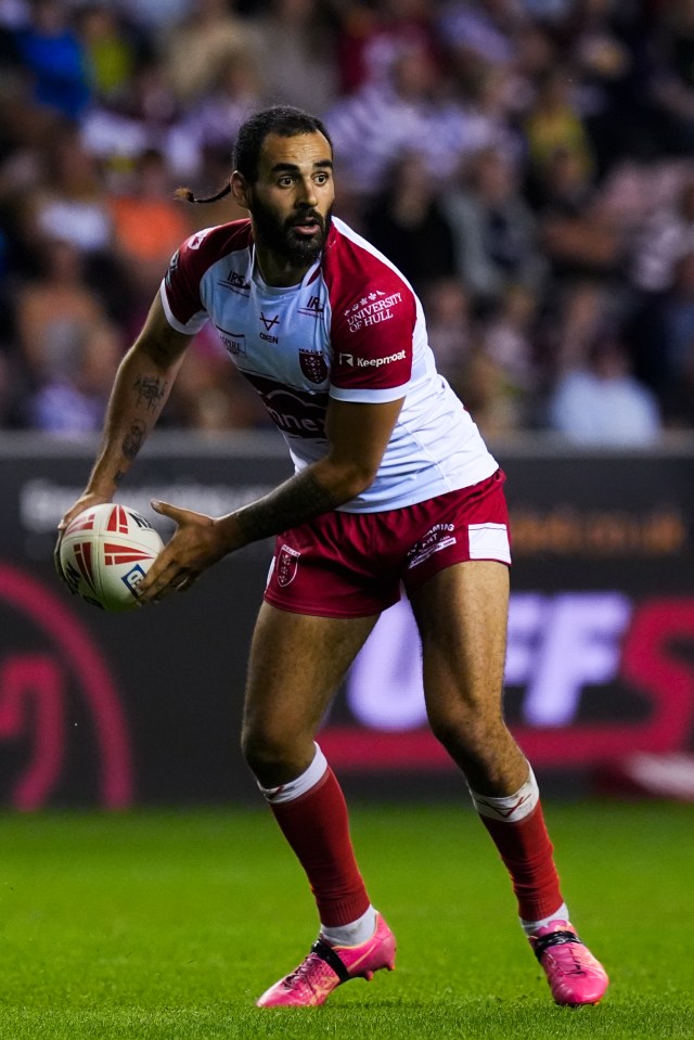 a rugby player wearing a jersey that says ' rugby ' on it