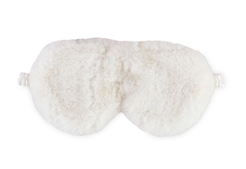 a white furry eye mask on a white background