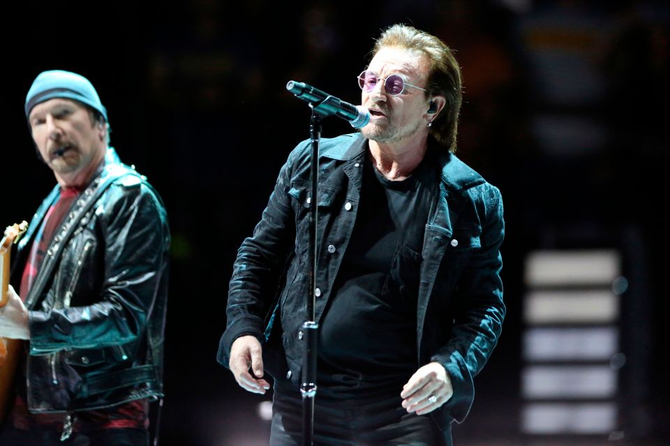 The Edge (L) and Bono (C) of the Irish rock band U2 perform on stage in Paris on September 8, 2018. (Photo by Zakaria ABDELKAFI / AFP)        (Photo credit should read ZAKARIA ABDELKAFI/AFP via Getty Images)