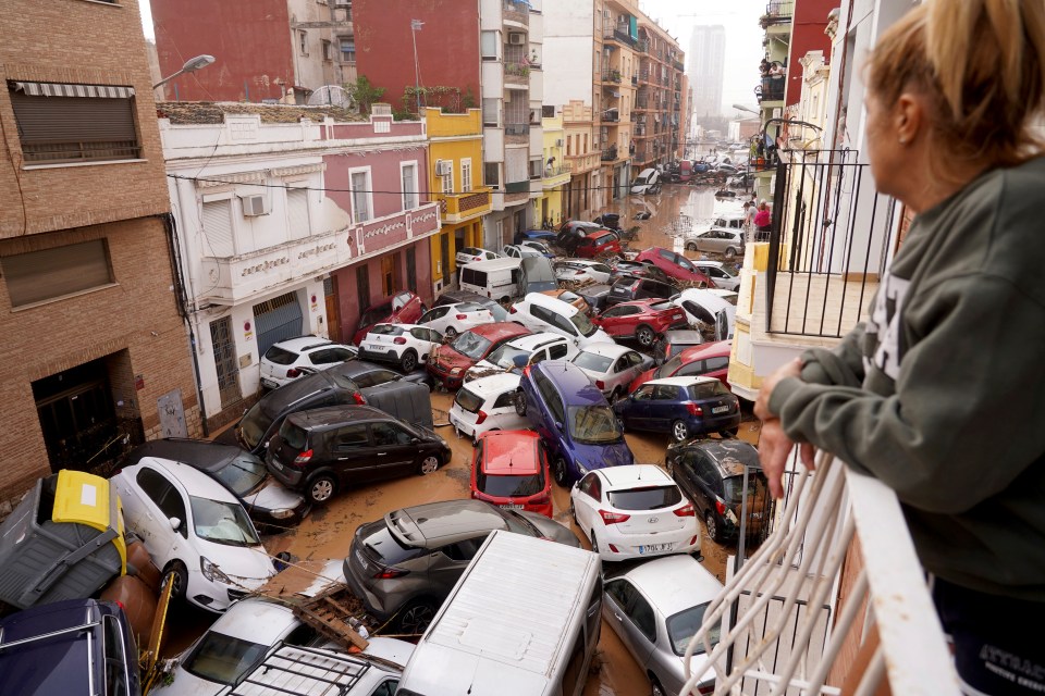 Cars pile up on a road in Valencia after the heavy rain