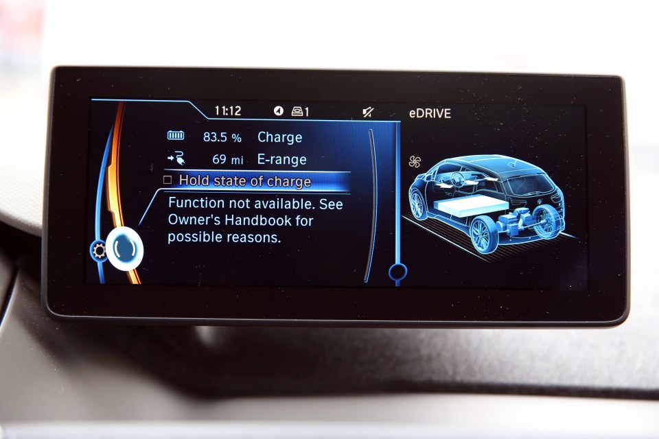 PIC JON BOND. 06.11.2013 SUN'S KEN GIBSON ROAD TESTS THE NEW BMW i3 ELECTRIC CAR THROUGH THE STREETS OF LONDON IN DRIVING WIND & RAIN TODAY WITH JON BOND. PIC SHOWS DASHBOARD COMPUTER SHOWING STATE OF BATTERY CHARGE.