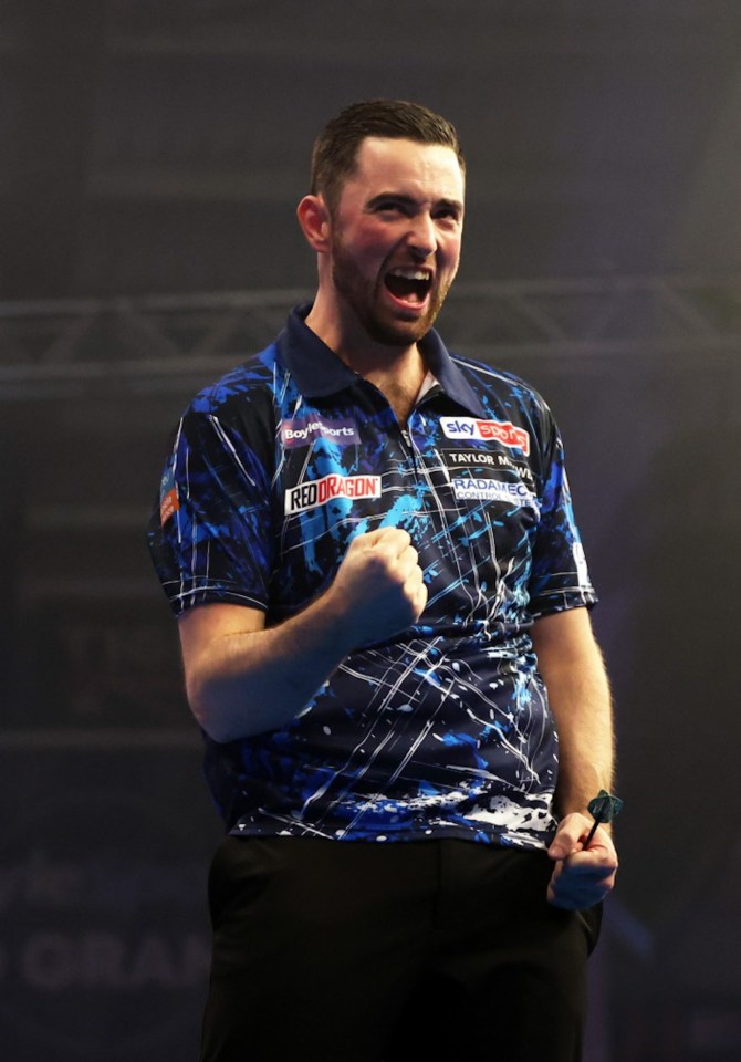 LEICESTER, ENGLAND - OCTOBER 12: Luke Humphries of England celebrates victory over Ryan Joyce of England during the Semi-Final match on day six of the 2024 BoyleSports World Grand Prix darts at Mattioli Arena on October 12, 2024 in Leicester, England. (Photo by Cameron Smith/Getty Images)