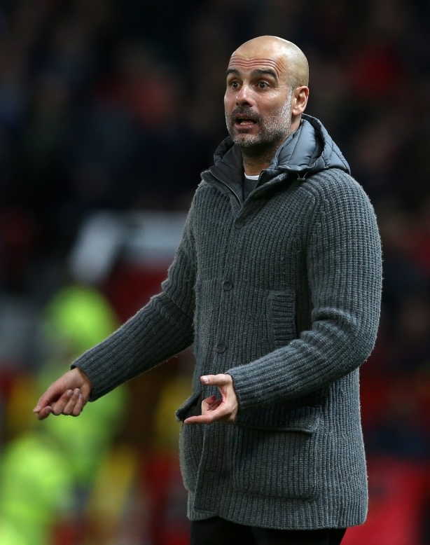 MANCHESTER, ENGLAND - APRIL 24: Manager Pep Guardiola of Manchester City watches from the touchline during the Premier League match between Manchester United and Manchester City at Old Trafford on April 24, 2019 in Manchester, United Kingdom. (Photo by John Peters/Man Utd via Getty Images)