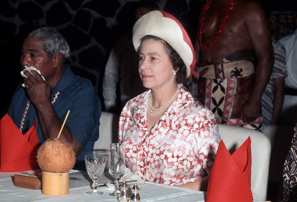 Queen Elizabeth II attends a traditional feast in Western Samoa in 1977