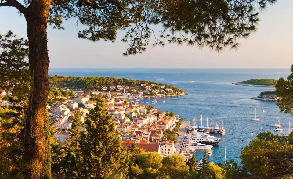 a view of a small town with boats in the water