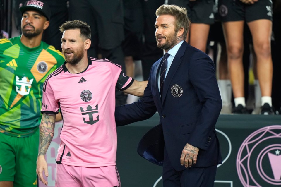 Inter Miami forward Lionel Messi, left, stands with co-owner David Beckham, right, during a ceremony for the team winning the Supporters' Shield after an MLS soccer match against the New England Revolution, Saturday, Oct. 19, 2024, in Fort Lauderdale, Fla. (AP Photo/Lynne Sladky)