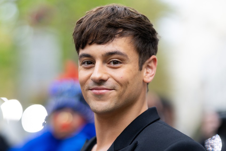 a close up of a man 's face with a blurry background