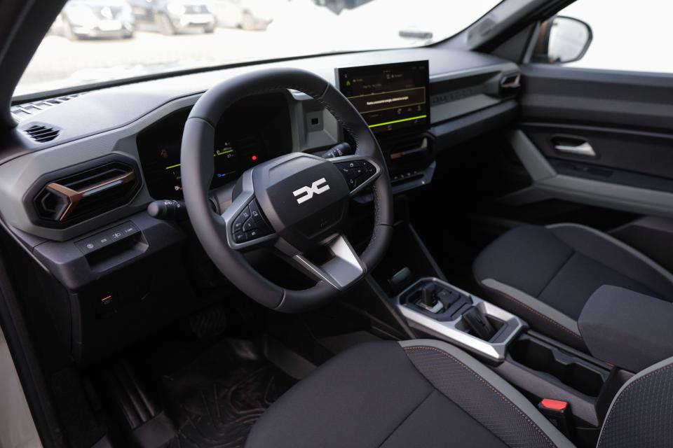 the interior of a dacia car with a steering wheel