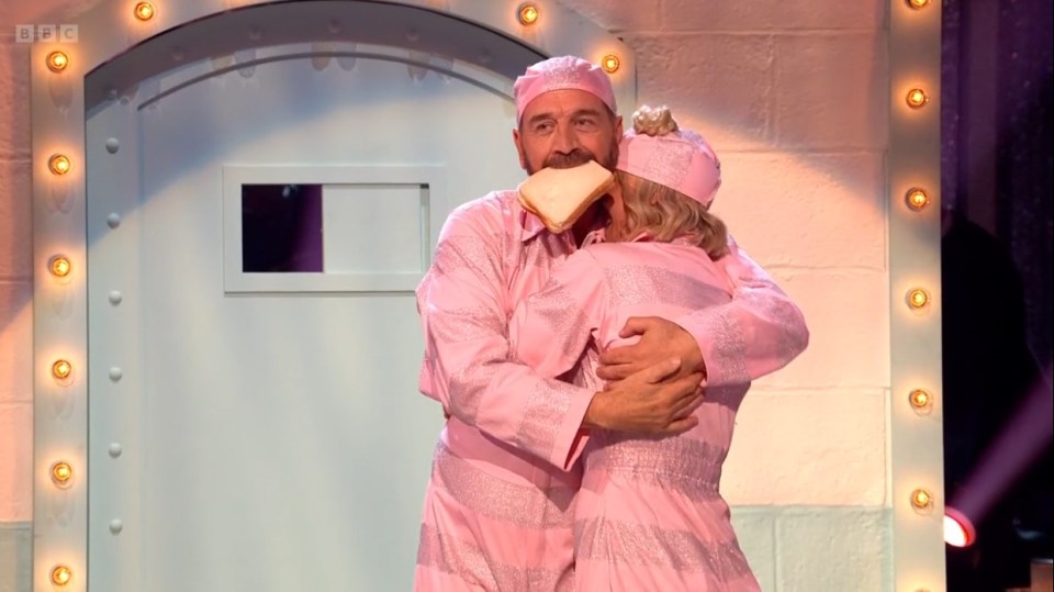 a man in a pink outfit is hugging a woman in a pink outfit