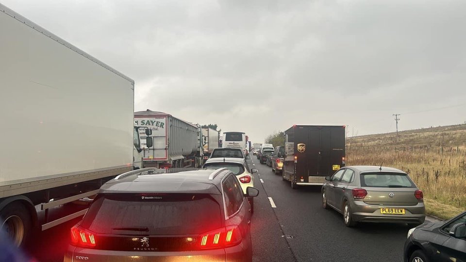 a peugeot car is in the middle of a traffic jam