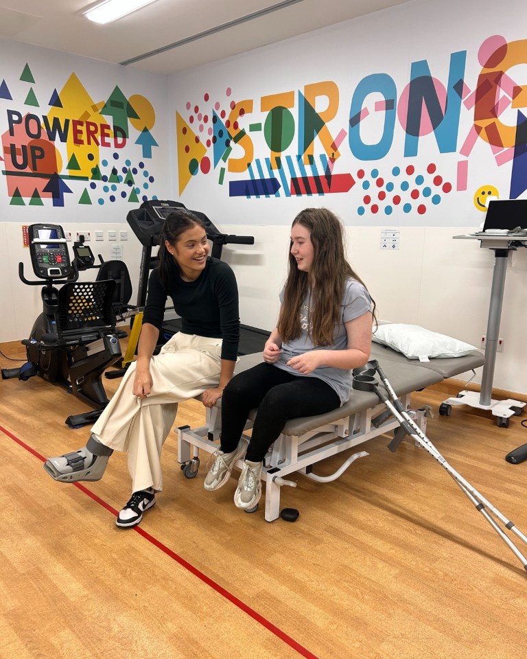 Emma Raducanu visited Great Ormond Street Hospital wearing a protective boot