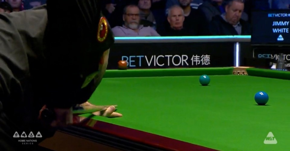 a pool table with a bet victor sign in the background