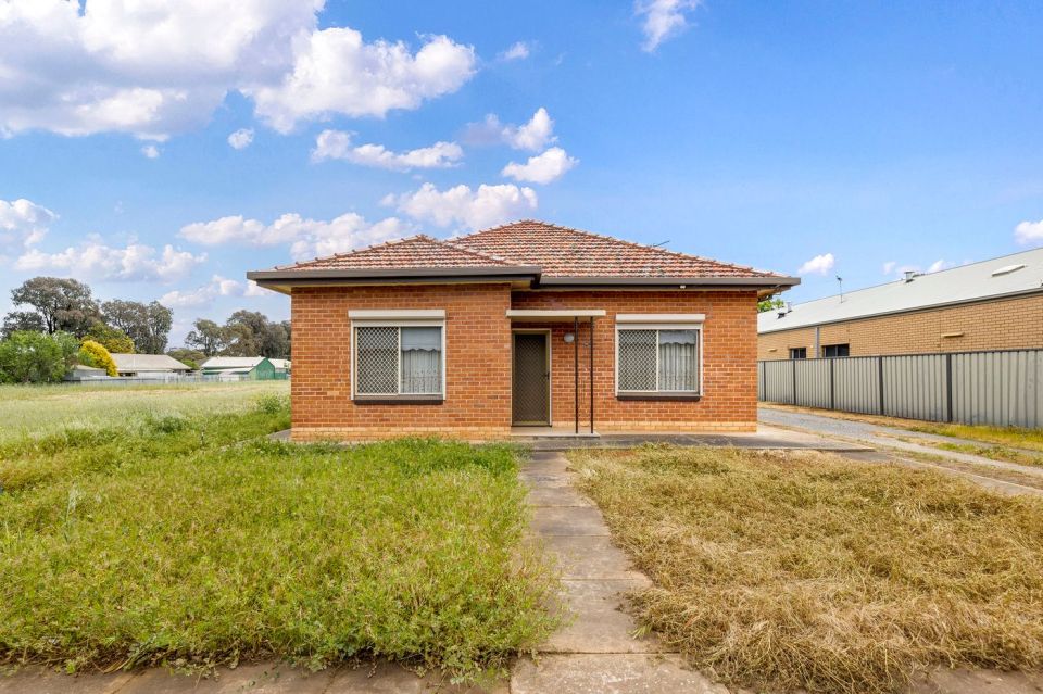 The house is a three-bedroom property with a shed