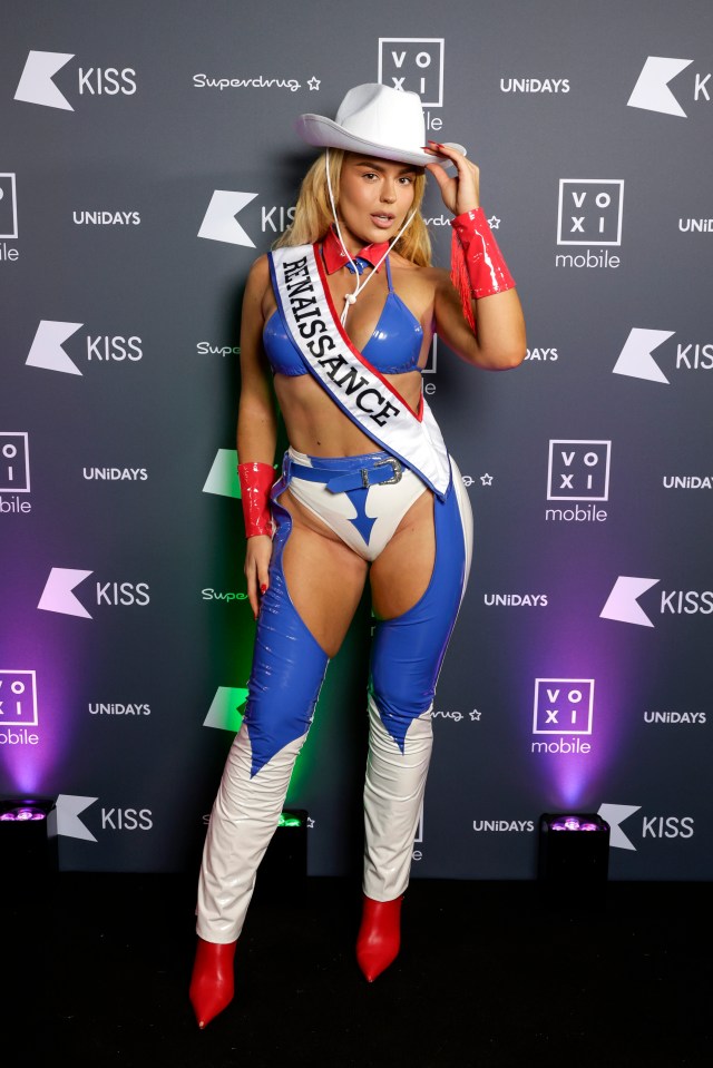 a woman wearing a sash that says renaissance on it