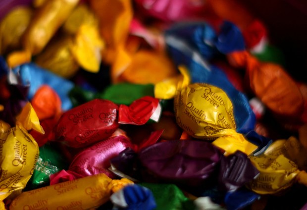 a pile of quality street candies in various colors