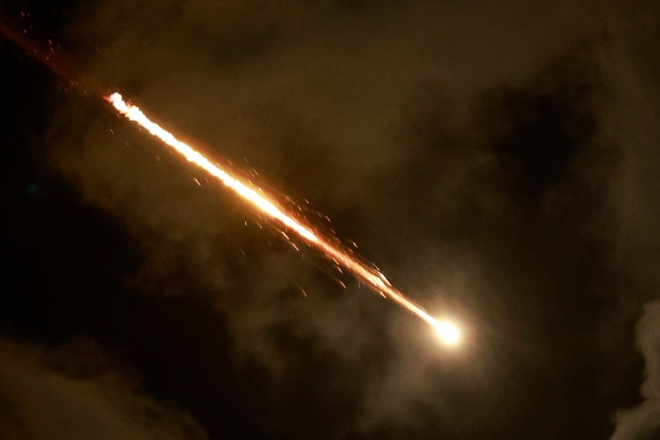 A rocket flies in the sky, amid cross-border hostilities between Hezbollah and Israel, as seen from Tel Aviv, Israel, October 1, 2024. REUTERS/Ammar Awad