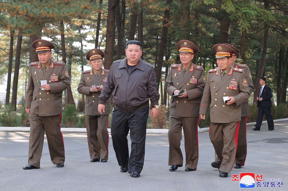 Kim Jong Un with military commanders. He is responsible for brutal crackdowns on opponents