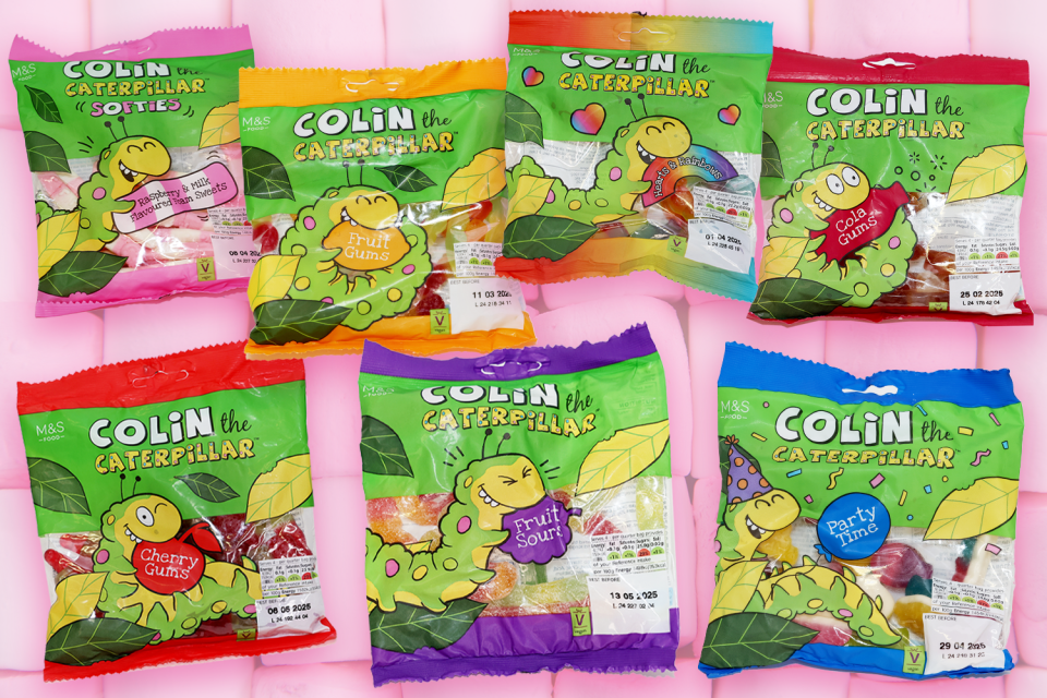 a bunch of bags of colin the caterpillar candy