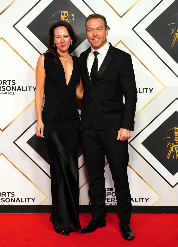 a man and woman pose on a red carpet that says sports personality