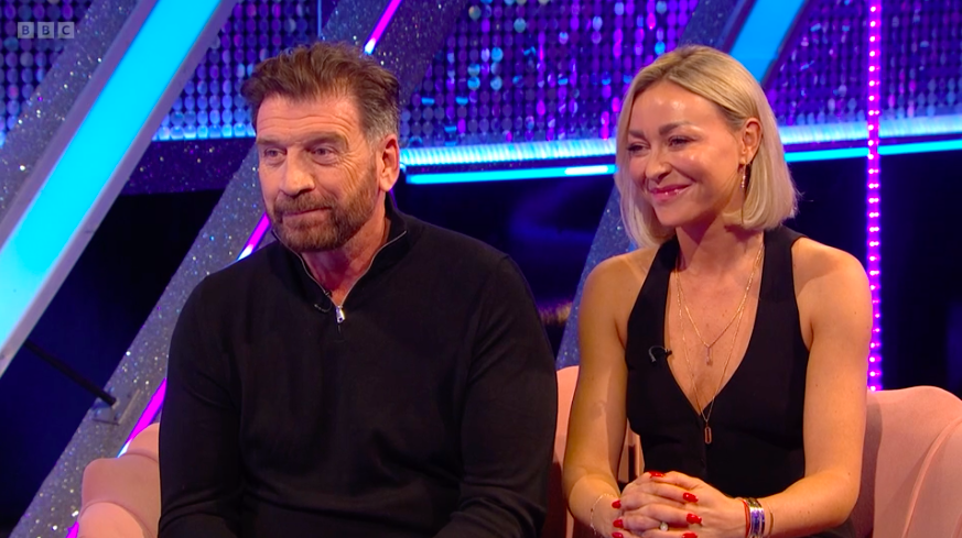 a man and a woman sit next to each other on a couch with bbc written on the bottom