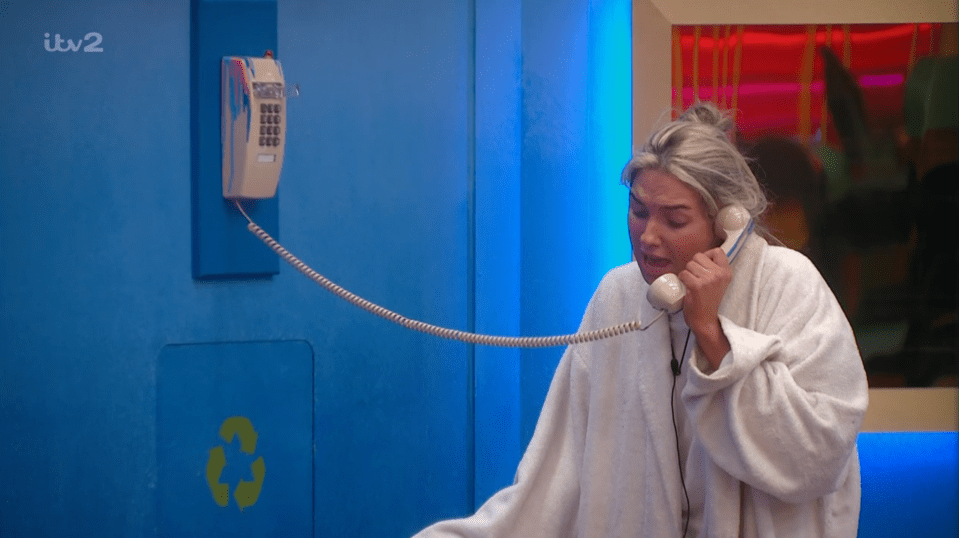 a woman talking on a phone with itv2 written on the bottom